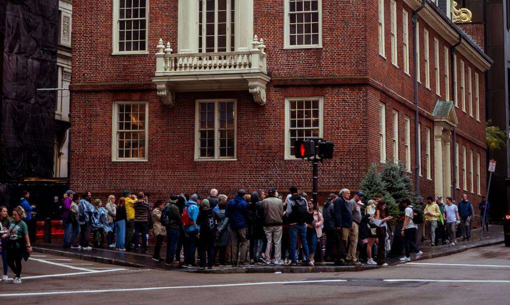 Historic brick building with people gathered outside