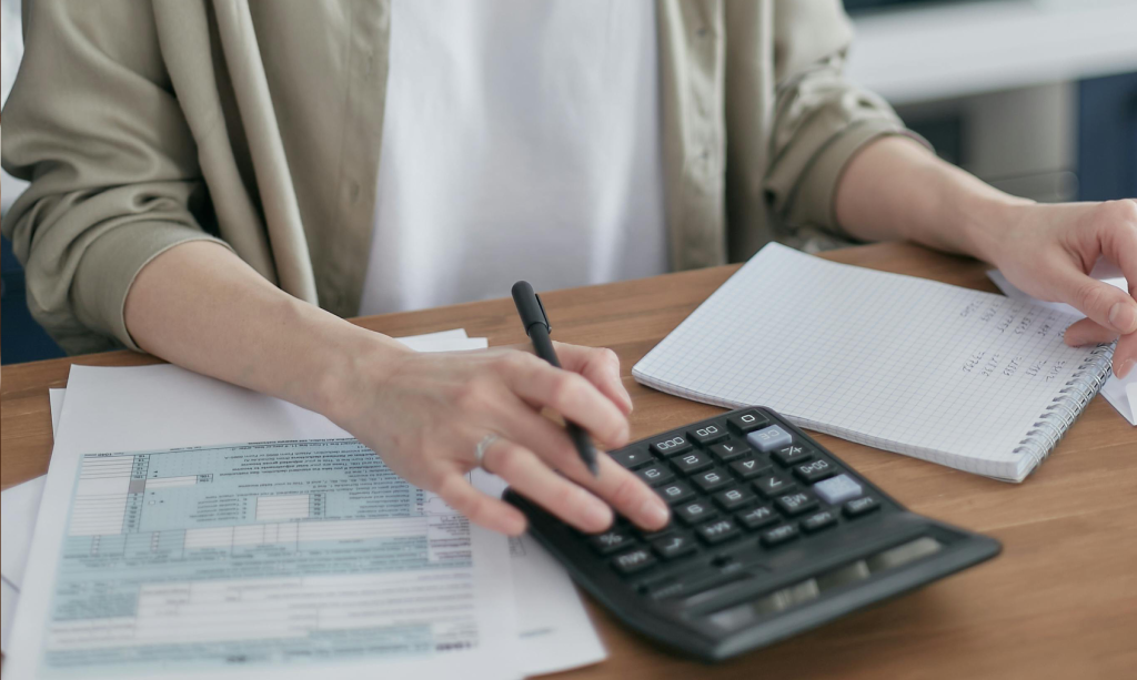 reviewing tax documents with a calculator