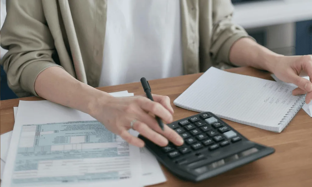 reviewing tax documents with a calculator